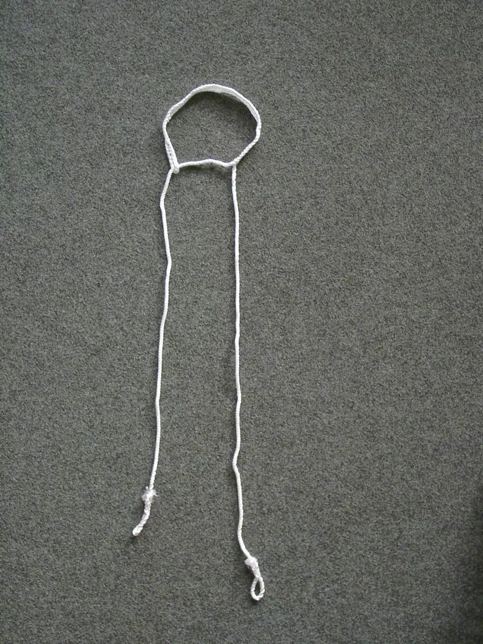 Geburtsstrick - Kopfschlinge